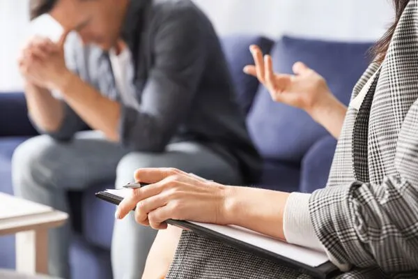 Psychiatrist-in-Phoenix-attentively-evaluating-a-patient-to-meticulously-develop-a-personalized-treatment-plan-600x400