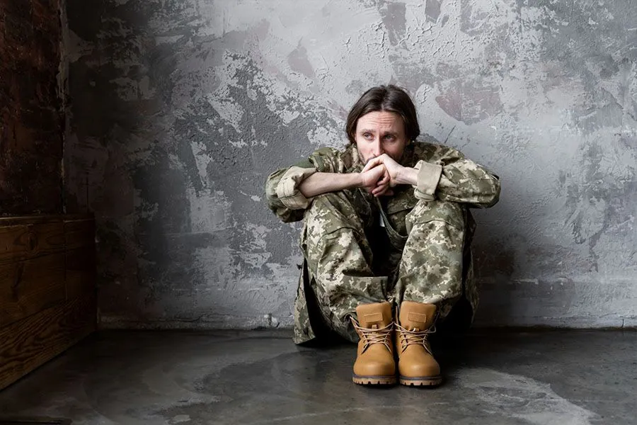 Soldier-sitting-on-the-floor-suffering-from-PTSD