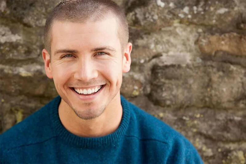 Young-man-smiling-concept-image-for-recovery-from-depression-800x533